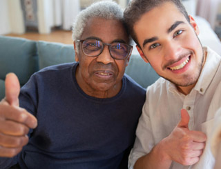 Care worker with patient in their home