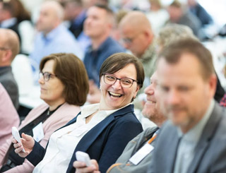 People enjoying off-the-job learning at a lecture
